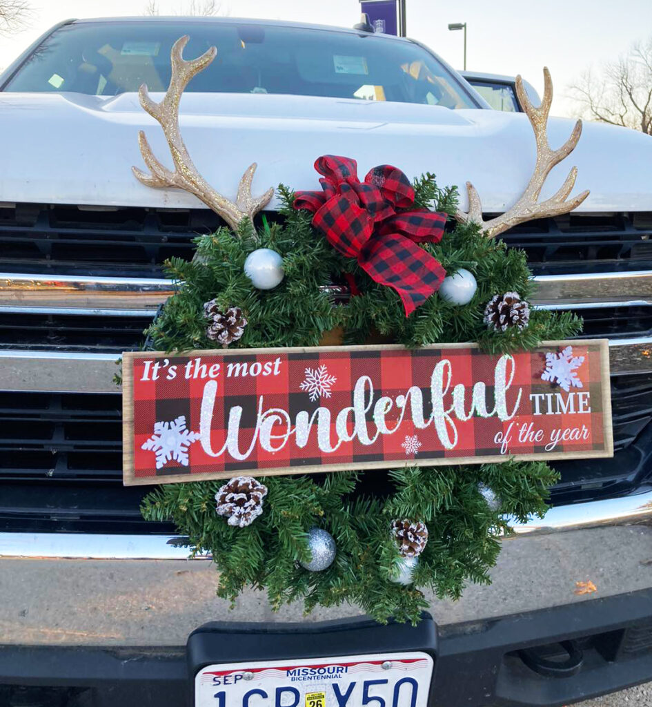 front of truck with Christmas decorations